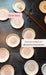 Incense holders being glazed with a brush on a wooden surface, with 'Clayground Catskills' branding.